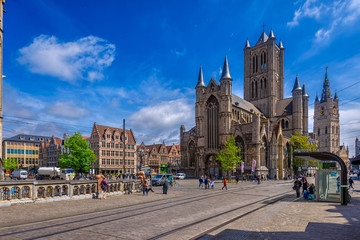 Medieval city of Gent (Ghent) in Flanders with Saint Nicholas Church and Korenmarkt square, Belgium. Sunny cityscape of Ghent.  Sunny cityscape of Ghent.