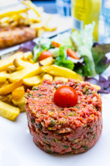 tasty Steak tartare (Raw beef) - classic steak tartare on white plate