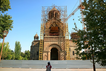 Visitor Photographing the Mother See of Holy Etchmiadzin under Restoration, Vagharshapat City of Armenia in October 2019
