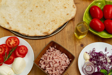 homemade pizza. ingredients, pizza base, tomato sauce