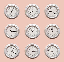 A lot of same clocks showing different times hanging on the pale orange wall
