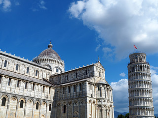 Obraz premium View of the Pisa Cathedral (Duomo di Pisa) and the Leaning Tower of Pisa (Torre pendente di Pisa) in Pisa, Italy. They are located in Miracoli Square (Piazza dei Miracoli).