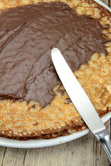 bunch of pancakes with chocolate spread