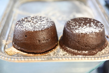 Fototapeta na wymiar Individual chocolate lava cake dusted with powdered sugar