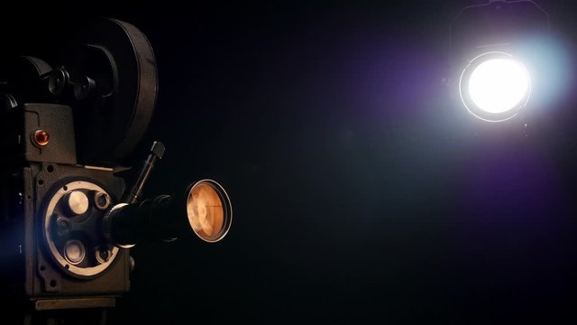 Movie Camera in Front of Black Backdrop.