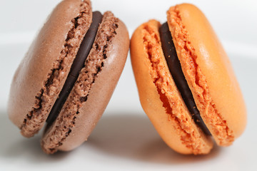 Delicious macaron sweets arranged in rows, colorful macaroon dessert on white background. -Image
