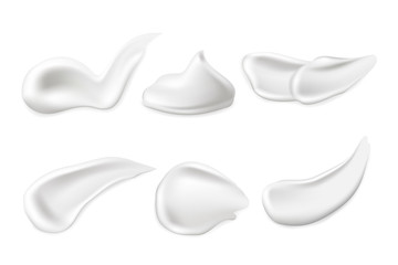 Set of cosmetic cream smears on white background