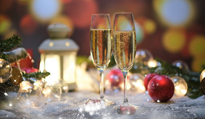 glasses with champagne against the background of New Year's decoration