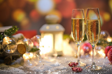glasses with champagne against the background of New Year's decoration