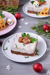 Salty cheesecake garnished with roasted champignons. New Year 2020 appetizer with mice of quail eggs, symbol of the new year