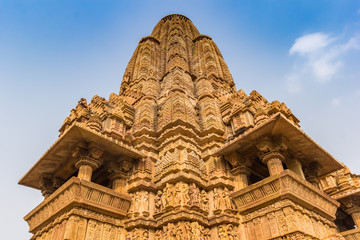 Fototapeta na wymiar Decorated tower of the temple complex in Khajuraho, India