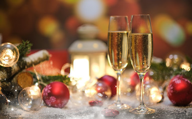 glasses with champagne against the background of New Year's decoration