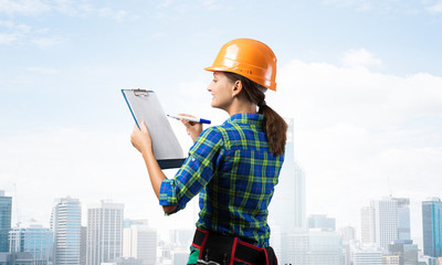 Young building controller with clipboard