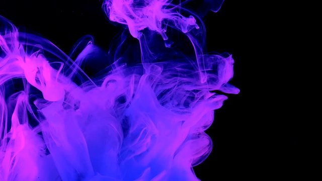 Phantom blue abstract background. Stylish modern background. Cool trending screensaver. Blue and pink watercolor ink in water on a black background. A powerful explosion of colors.