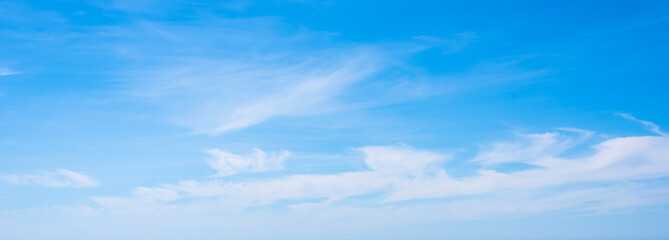 Naklejka na ściany i meble Small white clouds and blue sky