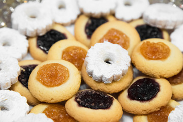 Cookies with jam and icing sugar close up