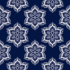 Seamless pattern in indian style. Dark blue background with white design