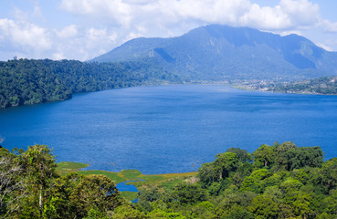 Fototapeta na wymiar View of lake Buyan (Danau Buyan) from the top. Landscape with lake and mountain views. Bedugul, Buleleng, Bali, Indonesia.