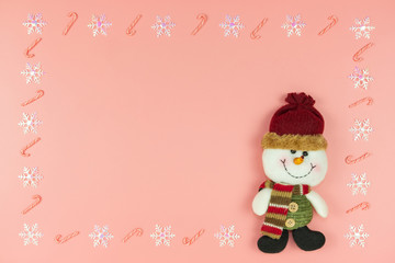 Fototapeta na wymiar Christmas background concept.,Top view christmas decoration snowman, snowflake and candy cane on pastel or pink background with copy space for text.