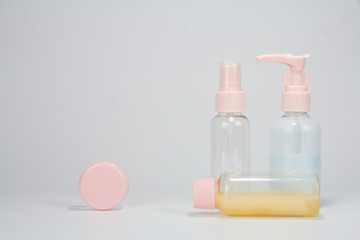 Set of plastic liquid containers for gel, lotion, cream, shampoo, bath foam (transparent). Plastic bottle with dispenser pump, sprayer and jar.