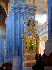 Fototapeta na wymiar Sunbeams illuminating the colorful interior in the Church of the Holy Archangel Michael in Lviv, Ukraine