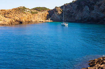 Fototapeta na wymiar View of the bay of Sa Tuna with a anchored ship, Begur, Costa Brava, Catalonia, Spain