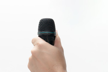 Hand holding a microphone isolated on white background.
