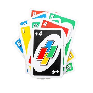 Pile of Uno game cards isolated on white background, front view flat lay cut out picture on 8 September 2019 in Vilnius, Lithuania
