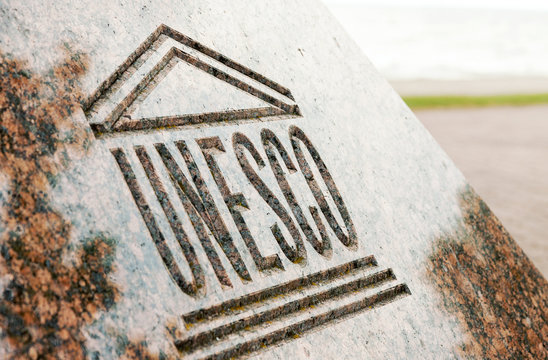 Close up of UNESCO world heritage sign carved on stone on 18 August, 2017 in Juodkrante, Lithuania