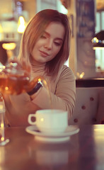 morning breakfast in a bright cafe, a cozy portrait of a young model, lifestyle at home