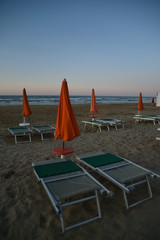 Umbrellas on the Beach at Sunset by Summer