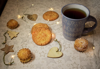 cookies and cup of tea on wooden table