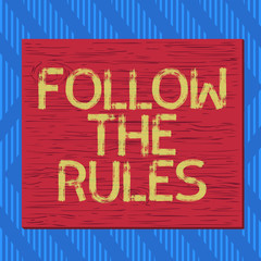 Text sign showing Follow The Rules. Business photo text order someone stick to certain place country guides stricts Square rectangle unreal cartoon wood wooden nailed stuck on coloured wall