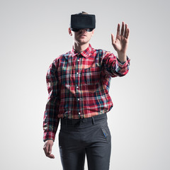 Guy in mask experiencing virtual reality as new entertainment device