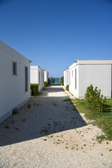 Fototapeta na wymiar Holidays Bungalows by Morning with Path and Garden
