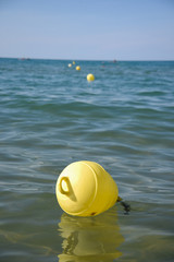 Buoys in the Water on the Sea by Summer