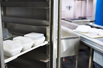 Plastic food containers in hospital kitchen