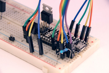 circuit Board with radio parts and colored wires.