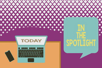 Text sign showing In The Spotlight. Business photo text when crowd concentrating with individual demonstrating Upper view office working place laptop lying wooden desk smartphone side