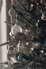 Christmas tree decorations. White and silver ornaments. Old fashioned Christmas tree ornaments. Festive winter time. Celebration. This time of the year. Tis the season. Sparkle lights. Green natural