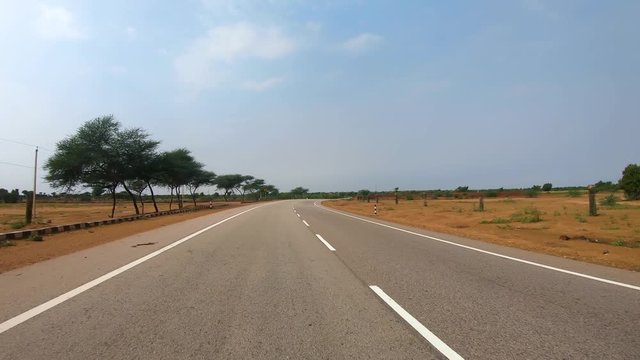 Driving a Car on a Road in Rajasthan India