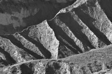 Large scars in the southern desert hills due to erosion