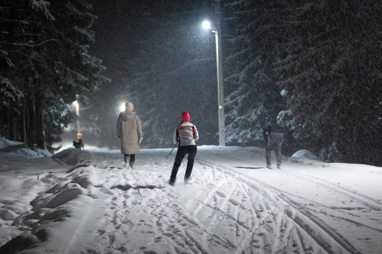 Snowfall At Night. Cross Country Ski.Skiing At Night By The Light Of Lamps In The Snow.