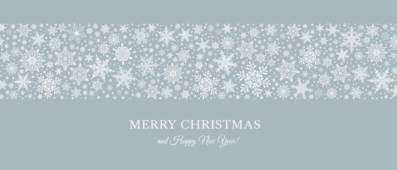 Fototapeta premium Decorative Christmas background with bokeh lights and snowflakes.