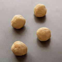 Peanut butter cookie dough on baking sheet