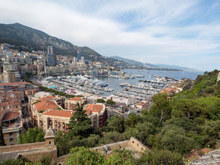 Naklejka premium Monaco, july 2019: Panoramic view of port. Azur coast. Colorful bay with a lot of luxury yachts in sunny day