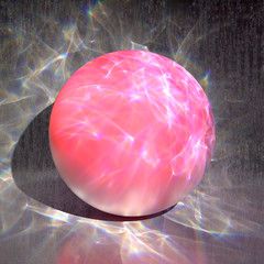 Artistic composition of a pink sphere illuminated with caustic lights, on a gray concrete background