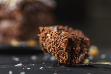 Chocolate cake in black plate on wooden table