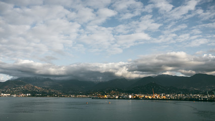 Panoramic view of the mountains and the sea in the city of Batumi. Georgia at sunset