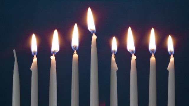 Video Of Seven Lit Hanukkah Candles ON GRUNGE BACKGROUND And Shamash
